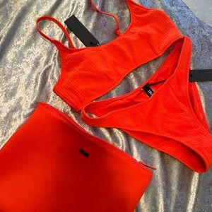 Bright orange ribbed triangl bikini. Size XL. New with tags.